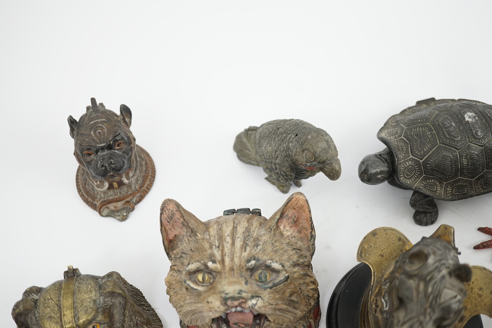 A collection of nine 19th and 20th century novelty animal bronze and metal ink wells, including a Martin Brothers-style ‘Wally’ inkwell. Condition - minor chips due to use and age